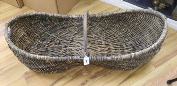 A French Provincial wine basket length 104cm width 40cm