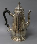 A George II silver coffee pot with later engraved decoration, ?F, London, 1735, 25.3cm, gross 28