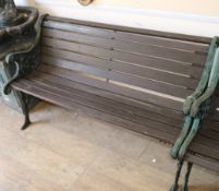 A wrought iron garden bench W.128cm