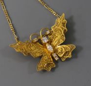An 18ct gold and diamond set filligree butterfly pendant on chain, from The House of Igor Carl