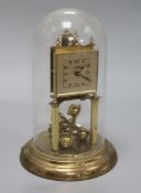 A gilt brass torsion clock under dome height 31cm