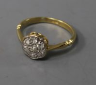 An 18ct gold and diamond cluster ring, size L.