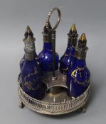 A George III silver six-bottle cruet stand, containing four original gilt-decorated blue glass
