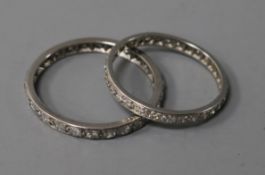Two white metal and diamond set full eternity rings, sizes S and W/X