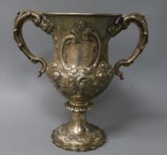 A Victorian embossed silver two handled presentation trophy cup, William Smily, London, 1863,