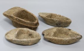 Four stone oil lamps