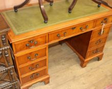 A yew wood pedestal desk W.122cm