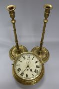 A brass bulkhead clock by Sewell, Maker to the Admiralty, Liverpool and a pair of tall brass slender