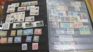 A box of world stamps in albums and stock books