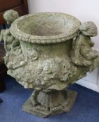A pair of reconstituted stone urns. H.65cm
