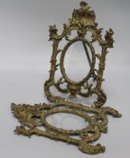 A pair of rococco-style ormolu easel picture frames, cast with foliate scrolls, shells and tied