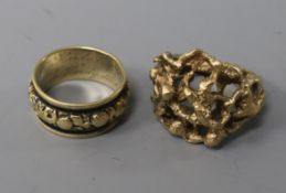 A George IV gold and black enamel mourning ring and a 9ct textured gold ring.