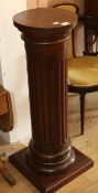 A stained pine fluted column base W.40cm