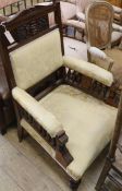 A Victorian walnut upholstered armchair