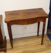 A Victorian walnut serpentine tea table with folding top W.85cm