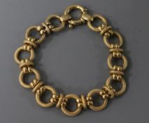 An Italian Uno A Erre 9ct gold textured circular link bracelet.
