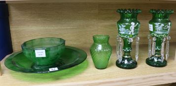 A pair of Victorian 'Mary Gregory' green glass lustre vases and three other pieces of green