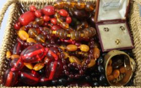 A small group of assorted bead necklaces including amber and simulated amber, a cased set of three