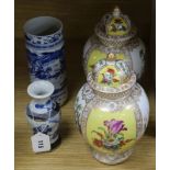 A pair of Dresden vases and covers and two Chinese blue and white vases