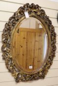 An oval gilt mirror W.65cm