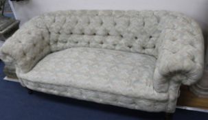 A Victorian walnut Chesterfield settee covered in deep-buttoned fabric W.180cm