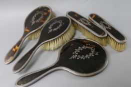 A Mappin & Webb five-piece silver pique and tortoiseshell-mounted dressing table set, comprising a