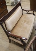 An Art Nouveau carved framed upholstered settee W.124cm