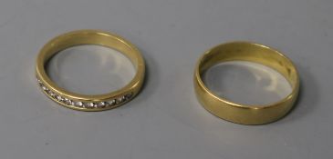 An 18ct gold and diamond half eternity ring and an 18ct gold wedding band.