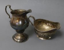 Two Georgian silver cream jugs including inverted pear shape.