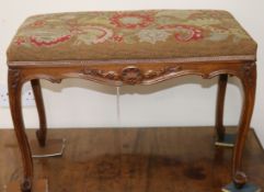 A Louis XV style carved beech stool with tapestry-upholstered seat W.66cm