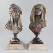 A pair of Austrian terracotta cold painted busts of Moors, 8.5in., on ebonised wooden socles with