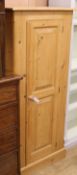 A slender pine cupboard W.66cm