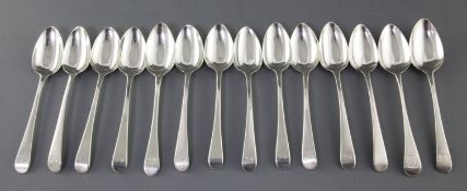 A harlequin set of fourteen George III silver Old English pattern dessert spoons, with engraved