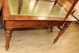 A Victorian mahogany two drawer writing table, with green leather inset top W.111cm