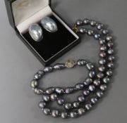 A single strand Tahitian? cultured pearl necklace, a similar bracelet and a pair of 9ct gold mounted