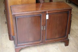 A Victorian mahogany panelled two door cupboard W.94cm