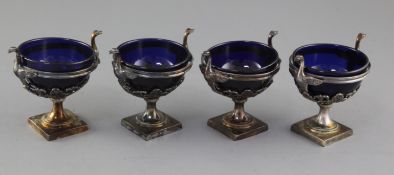 A set of four 19th century continental silver pedestal salts, with swan handles and foliate
