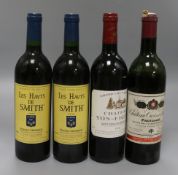 A bottle of Yon-Figeac, St. Emilion, 1998, two bottles of Les Haut de Smith, Pessac-Leognan, 1990