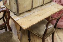 A Victorian pine drop flap table W.101cm