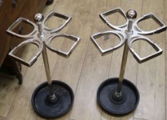 A pair of metal horseshoe shaped stick stands W.35cm