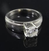 An 18ct gold and solitaire diamond ring, the round brilliant cut stone weighing approximately 0.