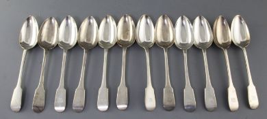 A set of twelve George V silver fiddle pattern table spoons, C.W Fletcher & Sons Ltd, with