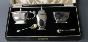 A cased 1930's Art Deco silver three piece condiment set, William Neale Ltd, Birmingham, 1937.