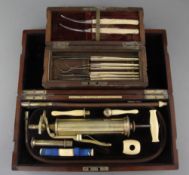 An Evans & Wormull ivory and brass medical pump, in original fitted case, 13in., and a cased set