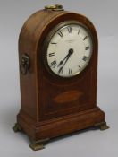 An Edwardian mahogany and inlaid mantel timepiece, height 11in.