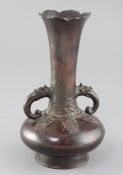 A Chinese bronze bottle vase, Song - Yuan dynasty, the petal rimmed trumpet shaped neck applied with