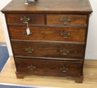 A George III elm chest, of two short and three long drawers W.89cm