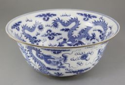 A large Chinese blue and white 'dragon' bowl, painted to the interior and exterior with