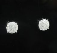 A pair of modern 18ct white gold and diamond cluster circular ear studs, set with round and princess