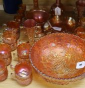 A pair of Carnival glass 'crucifix' candlesticks and a collection of other marigold Carnival